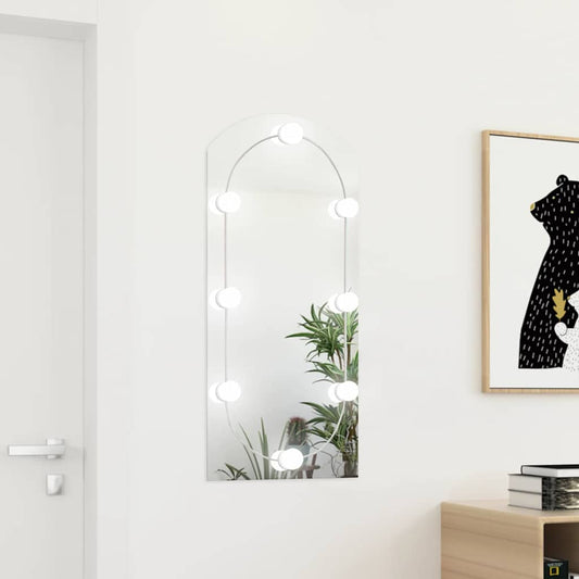 Väggspegel med LED-lampor 90x45 cm glas valvformad